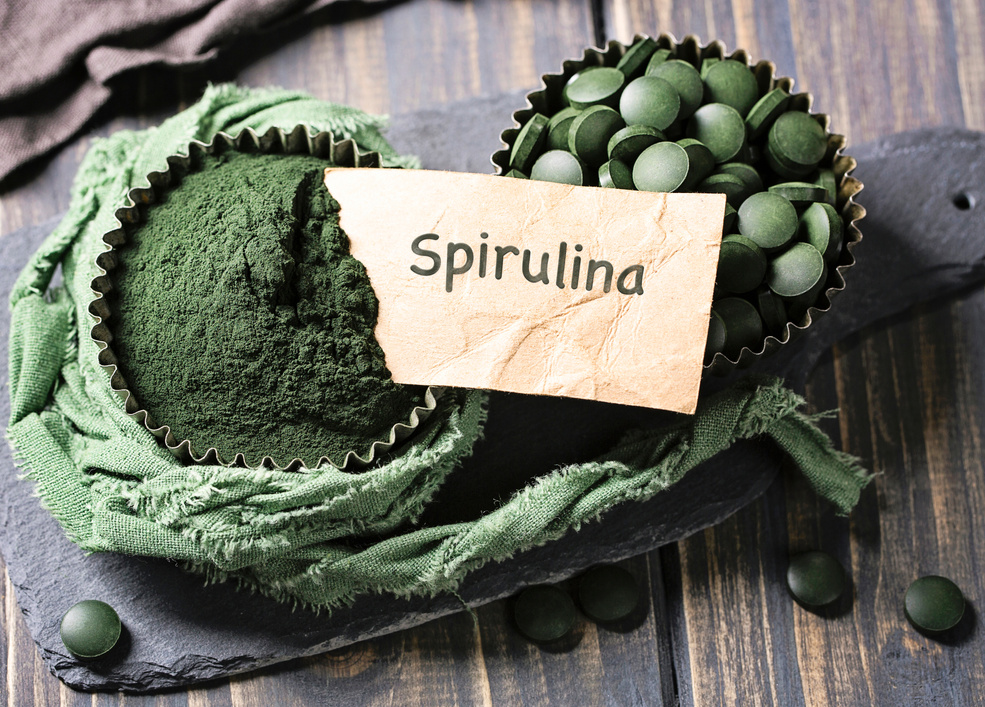 Spirulina tablets in a bowl